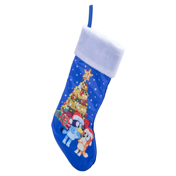 Kurt S. Adler Bluey™ and Bingo Wearing Santa Hats in Front of a Festive Christmas Tree on a Blue Stocking